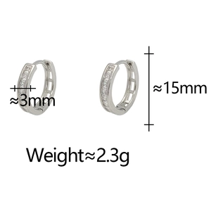 Minimalist silver huggie hoop earrings featuring a full row of sparkling cubic zirconia