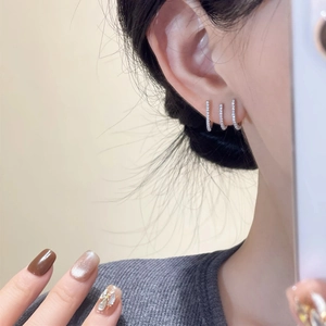 Three-piece set of silver minimalist huggie earrings with micro-paved white zircons