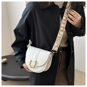 Detail of white saddle bag with golden U-buckle and logo jacquard wide shoulder strap