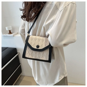 Contrast diamond lattice crossbody bag in cream and black with stylish knit texture