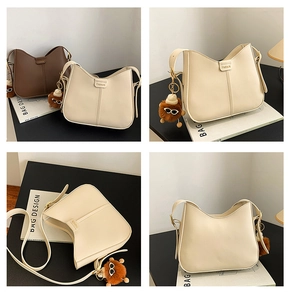 Macro views of smooth faux leather crossbody bags with fashion label and bear charms