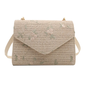 Chic woven straw crossbody bag with floral embroidery and triangle flap closure