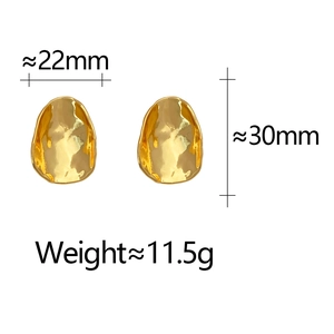Detailed view of irregular hammered texture gold earrings with size and weight metrics