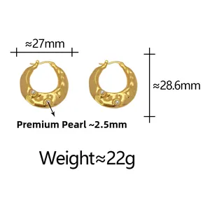 Close-up of golden irregular textured hoop earrings with white pearls and dimensions