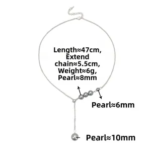 Detail showing Y-shaped silver pearl necklace with 6mm to 10mm grey pearls and measurements