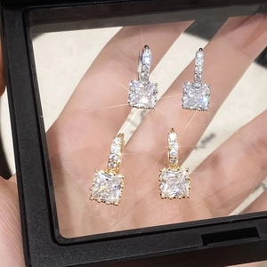 Elegant square zircon dangle earrings in gold and silver finish with pavé set accents