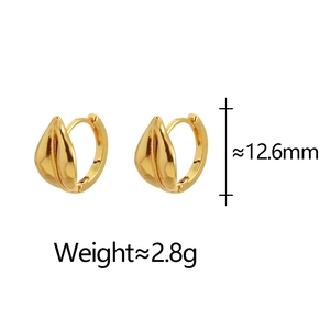 Detailed close-up of gold leaf-shaped hoop earrings showing texture and dimensions