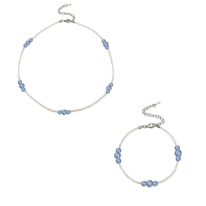 Vintage necklace and bracelet set with light blue natural stone beads on a white background