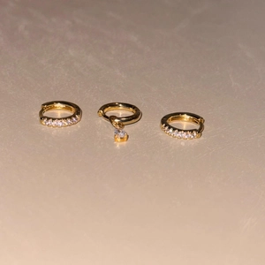 Three-piece gold micro-pave hoop earrings set with clear zircon and teardrop pendant