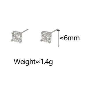 Detailed view of 6mm four-prong silver stud earrings with sparkling AAA cubic zirconia stones