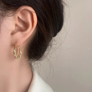 Exquisite gold twisted hoop earrings with micro-inlaid zircon stones for elegant women