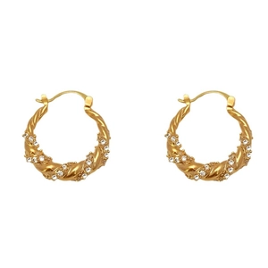 Golden twisted hoop earrings with micro-pave cubic zirconia on dynamic spiral design