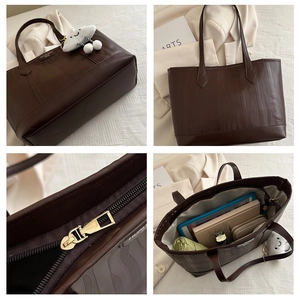 Detail of dark brown tote bag interior capacity showing tablet and daily essentials