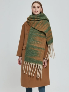 Detailed view of forest green and brown gradient thick knit scarf with chunky tassels