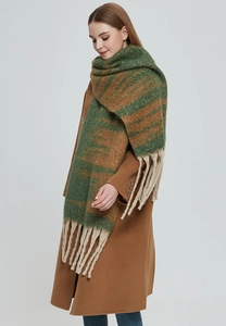 Close-up of thick gradient jacquard scarf with green and brown stripes and long tassels