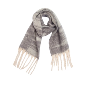Detailed texture of thick jacquard gradient scarf with soft chunky tassels