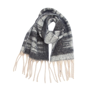Detailed view of thick gradient loop yarn scarf with long chunky tassels and knit texture