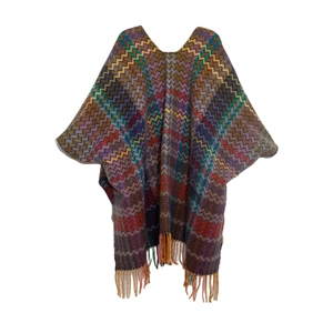 Detailed view of zigzag pattern knit shawl with colorful wave textures and long tassels