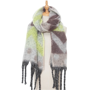 Close-up of geometric winter scarf with long black tassels and fuzzy texture detail