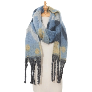Macro detail of thick blue and yellow heart jacquard knit scarf with black tassel fringe