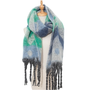 Detailed close-up of chunky knit scarf showing thick yarn texture and green geometric pattern
