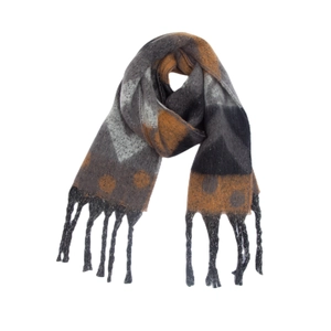 Macro detail of thick geometric heart pattern and long tassels on winter knit scarf