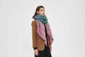 Detail of colorful gradient zebra knit scarf with thick brushed texture and fringe edges