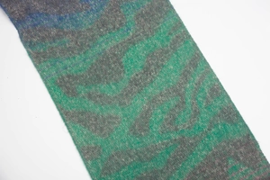 Macro view of diagonal zebra jacquard knit pattern on winter warm circle yarn scarf