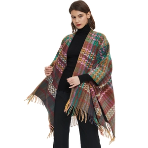 Ethnic knit shawl with colorful wave patterns and fringe hem for fall travel