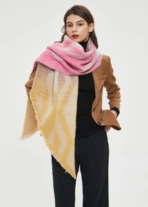 Detail of soft thick scarf with pink and mustard gradient pattern and fringe