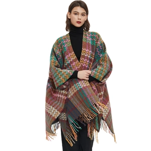 Knitted chevron pattern poncho with colorful tassels and sleeves for autumn winter fashion