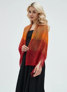 Detail of gradient knit shawl featuring hollow mesh texture and delicate tassel fringe trim