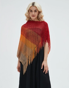 Detail of colorful gradient knit shawl with bohemian fringes and openwork mesh pattern
