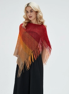 Detail of summer knit shawl showing gradient mesh texture and hanging fringe tassels