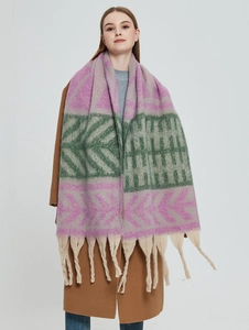 Detail of leaf jacquard knit scarf with purple and green patterns and thick beige tassels