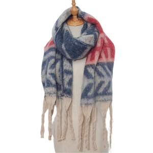 Close-up of thick geometric jacquard knit scarf with long tassels on a beige mannequin
