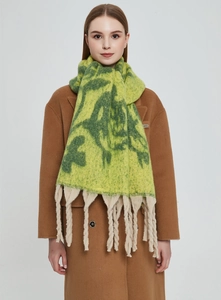 Detailed texture of jacquard rose pattern knit scarf with handmade chunky beige tassels