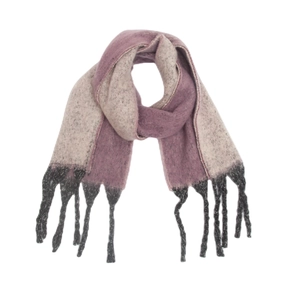 Close-up of thick knit gradient scarf with grey-pink bouclé yarn and black tassel detail