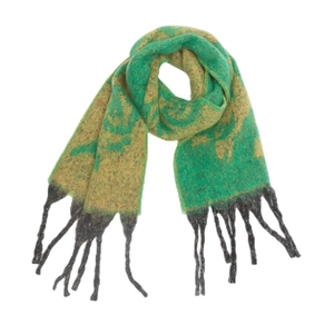Close-up of winter knit scarf showing green rose jacquard pattern and grey fringe tassels