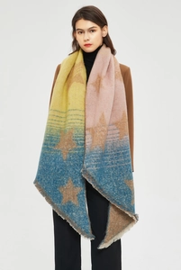 Detailed view of thick striped shawl with star patterns and soft fringe trim