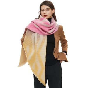 Thick geometric knit shawl wrap for women with pastel gradient colors and tassel fringe