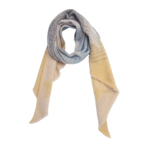 Detail of soft striped shawl featuring textured boucle yarn and subtle frayed edge finish
