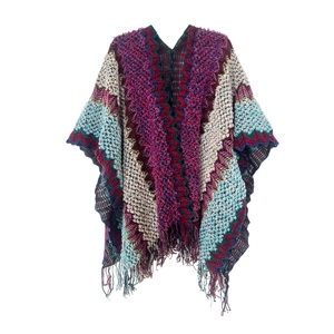 Detail of bohemian knit shawl with colorful wave patterns and long tassel fringe