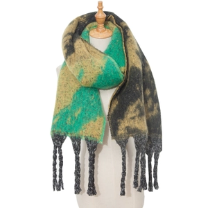 Detailed view of the thick knit texture and black fringes on the colorful star scarf