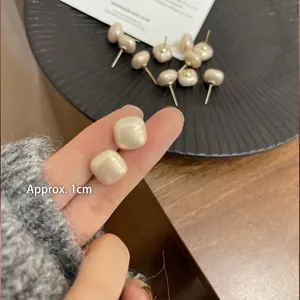 Elegant 1cm cream square pearl stud earrings for women with a minimalist metallic base