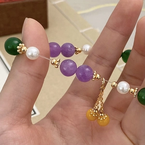 Colorful natural stone and pearl beaded bracelet with gold flower spacers and tassel