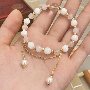 Elegant beaded bracelet with natural stones, white pearls and gold fringe pendant