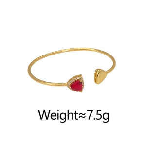 Detail of 18K gold-plated open cuff bracelet with red heart zircon and micro-inlaid stones