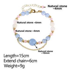 Detail view of double-layer beaded bracelet with natural stones and tassel in gold finish