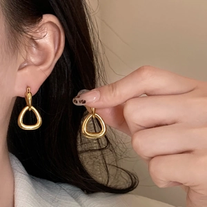 Minimalist gold hollow geometric triangle earrings with polished metallic finish